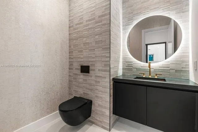 a kitchen that has a sink and a stove