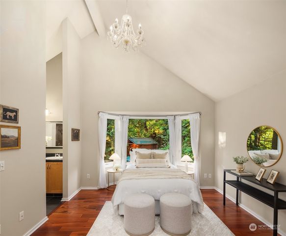 a bedroom with furniture and a window