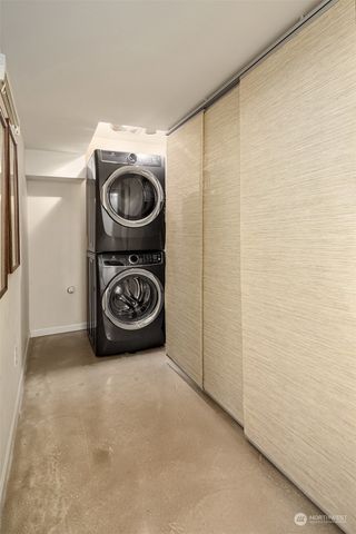 a view of a storage & utility room with a washer dryer