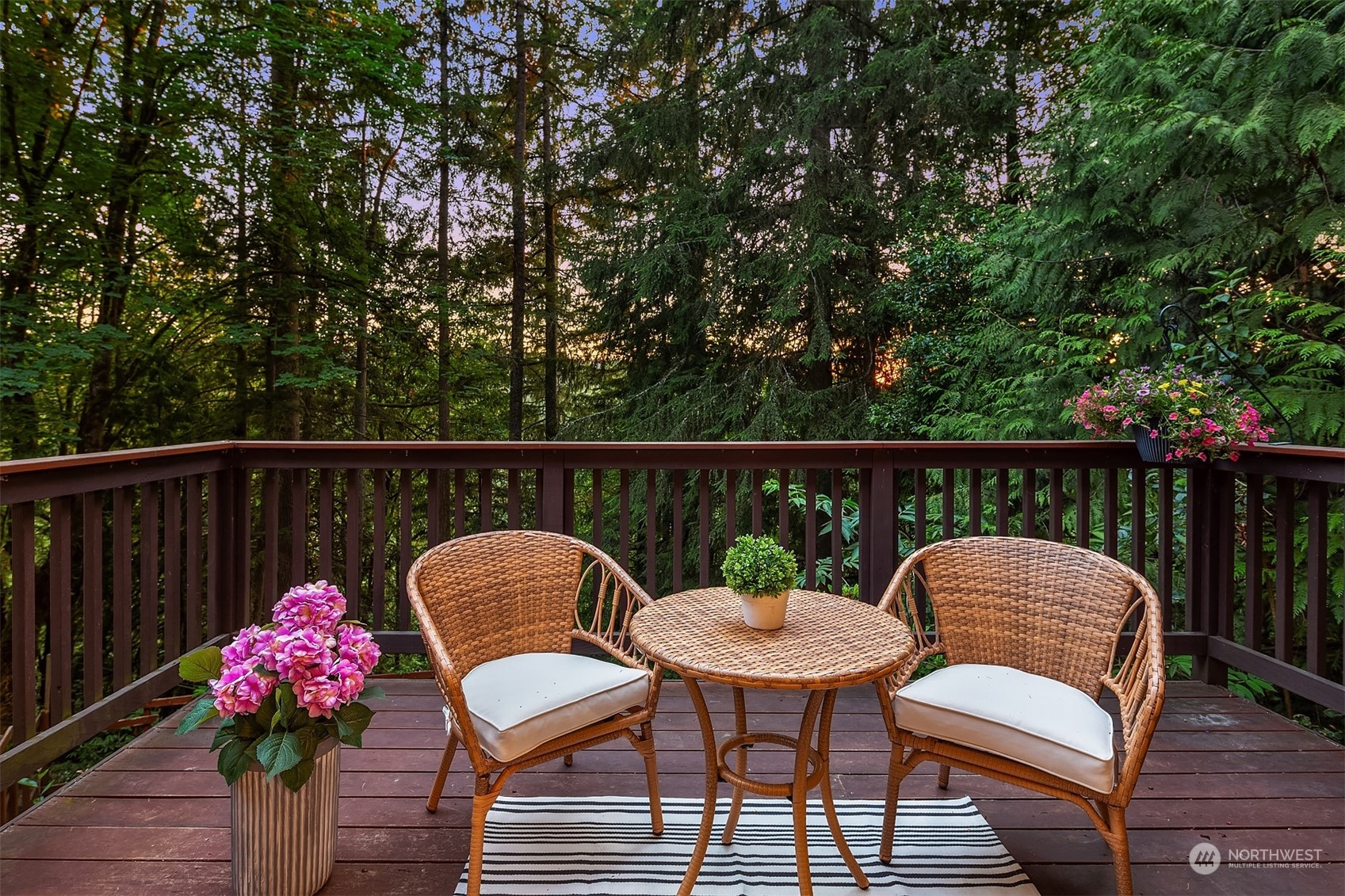 730 Redmond-Fall City Road Northeast Carnation, WA 98014 - Photo 35 of 40 a balcony with wooden floor potted plants and outdoor seating