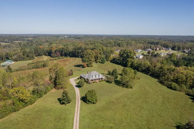 an aerial view of residential house with outdoor space