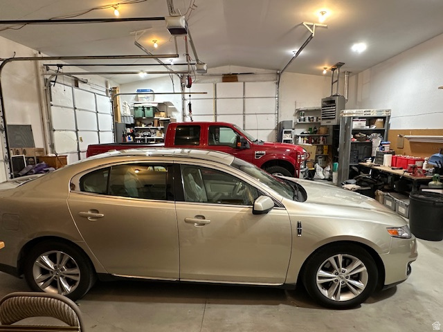 1454 East Little Sweden Road Heber City, UT 84032 - Photo 25 of 35 Garage with a heating unit and a garage door opener