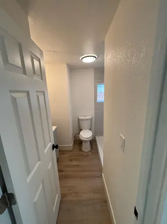 a bathroom with a sink a toilet and a shower