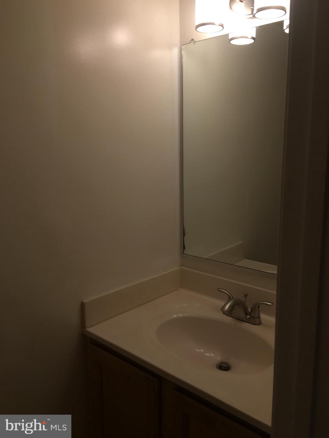 6159 Good Hunters Ride Columbia, MD 21045 - Photo 13 of 28 a bathroom with a sink and cabinets