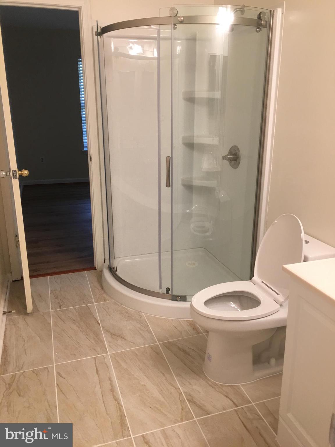 6159 Good Hunters Ride Columbia, MD 21045 - Photo 23 of 28 a bathroom with a shower and a toilet