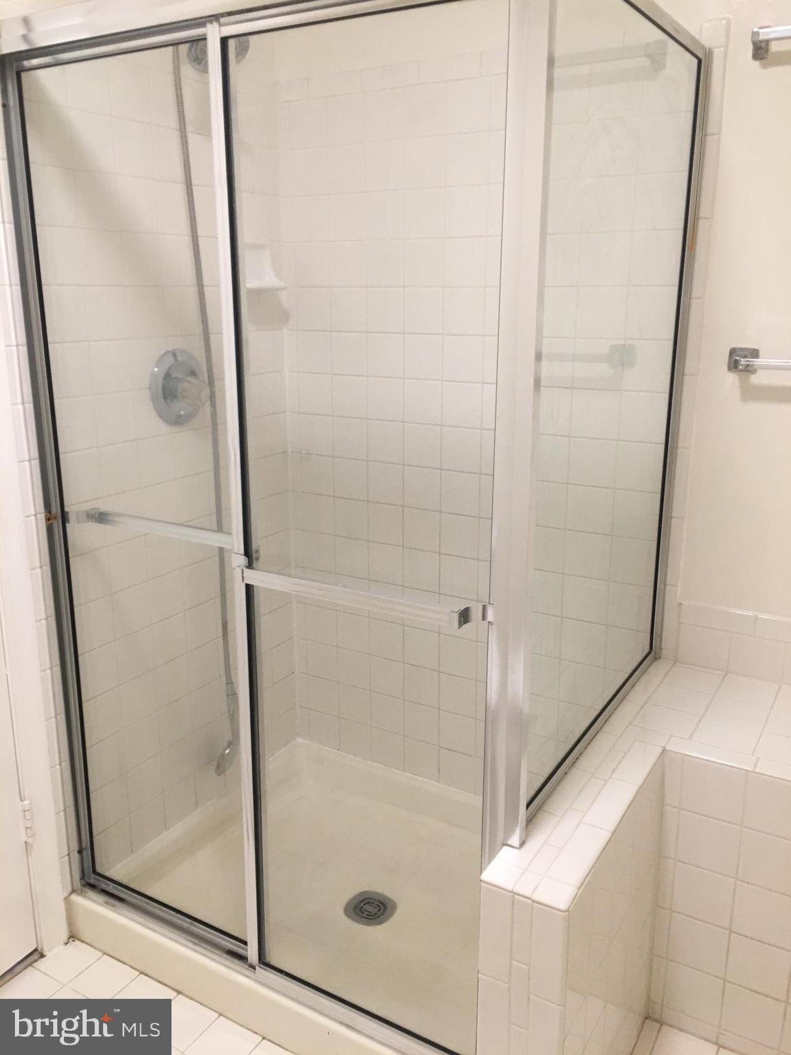 6159 Good Hunters Ride Columbia, MD 21045 - Photo 24 of 28 a bathroom with a glass shower door