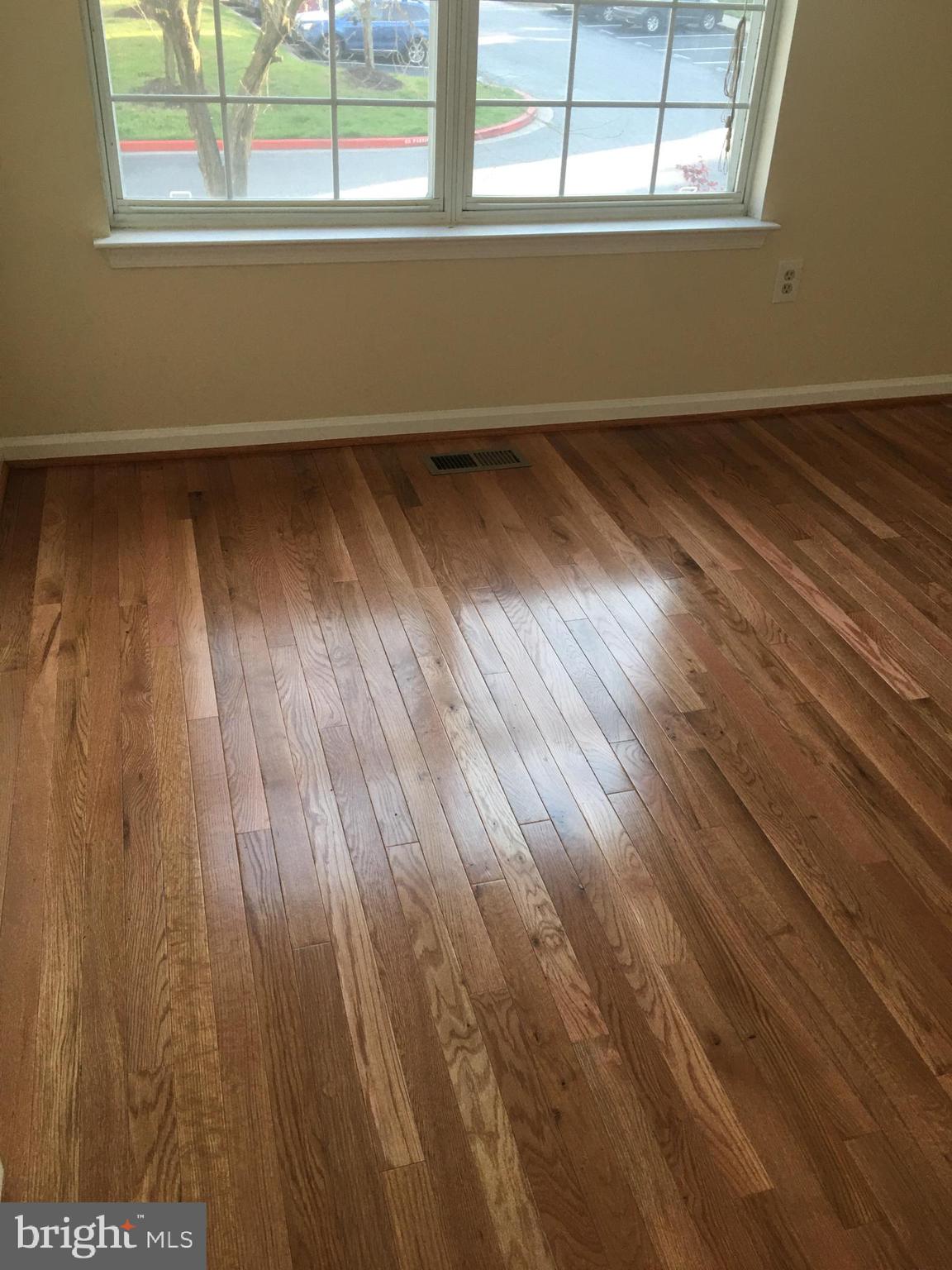 6159 Good Hunters Ride Columbia, MD 21045 - Photo 4 of 28 a view of a room with wooden floor and two window