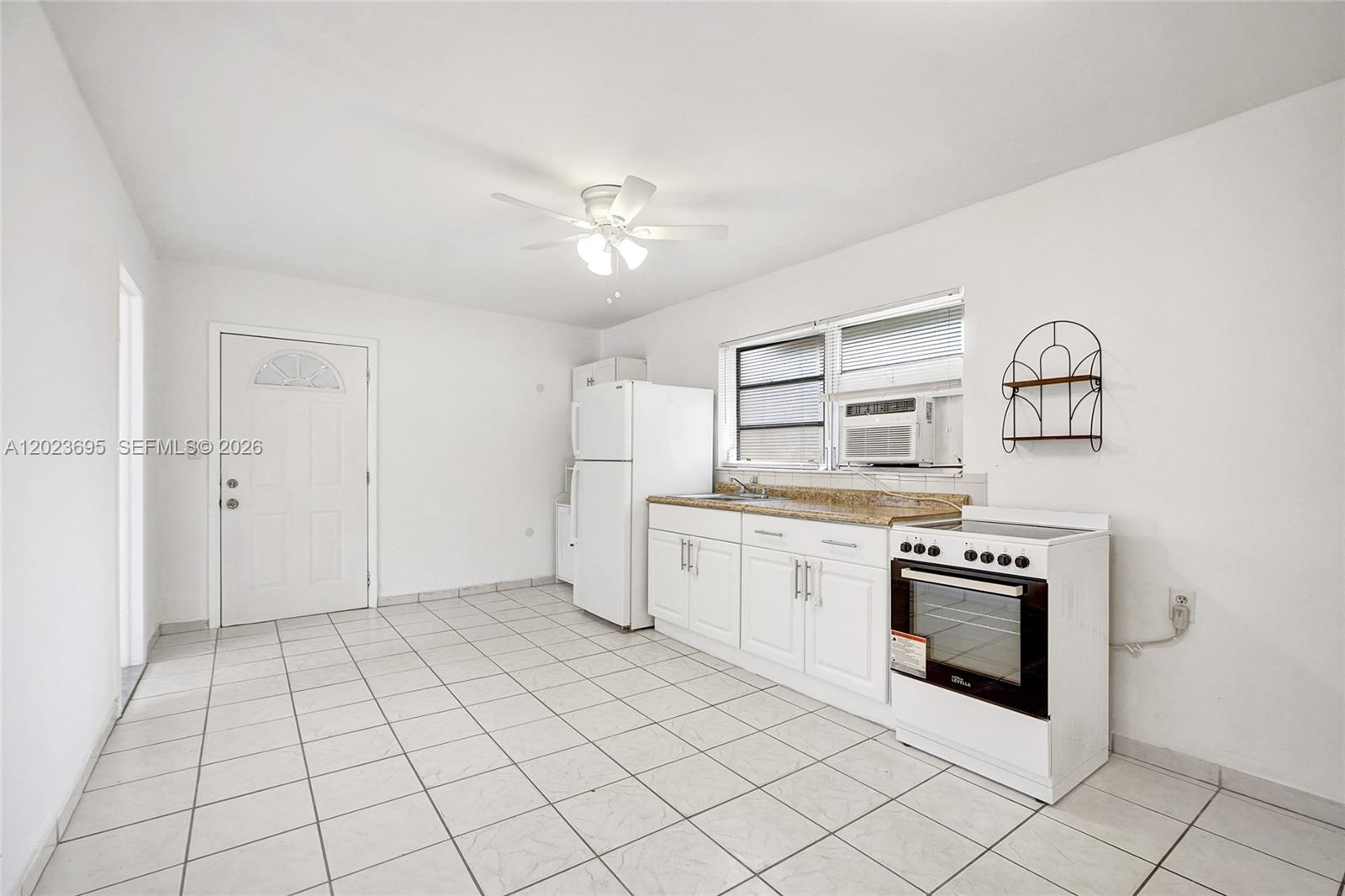877 West 33rd Street, Unit A Hialeah, FL 33012 - Photo 15 of 36 Kitchen/Family/Dining Area