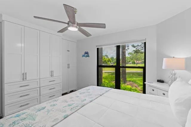 a bedroom with a large bed and a window