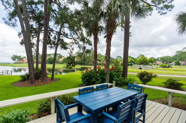 an outdoor space with furniture and garden