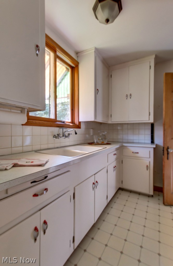 17622 Ingleside Road Cleveland, OH 44119 - Photo 8 of 22 Crisp white vintage kitchen overlooks the yard...