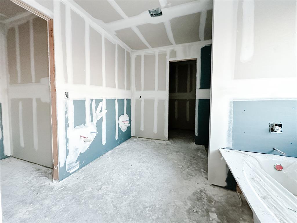 1109 Dillinger Road Hewitt, TX 76643 - Photo 11 of 13 a view of an empty room with cabinet and stairs