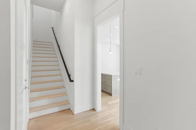 a view of a hallway with staircase