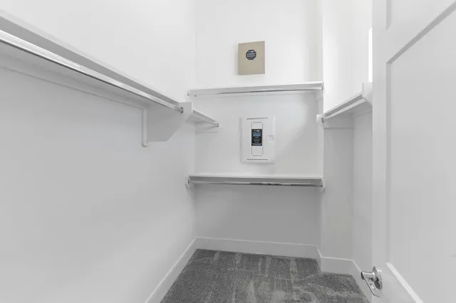 a view of an empty walk in closet