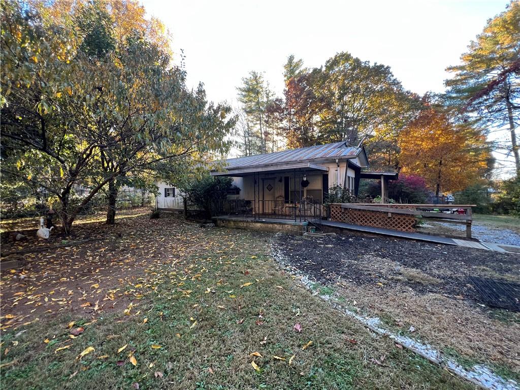 121 Jackson Heights Cleveland, GA 30528 - Photo 1 of 1 a view of a house with a yard and tree s