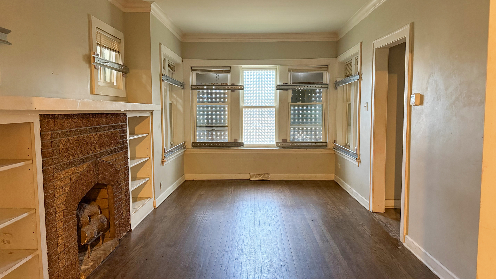 435 East 88th Place Chicago, IL 60619 - Photo 4 of 21 a view of an empty room with a window and wooden floor