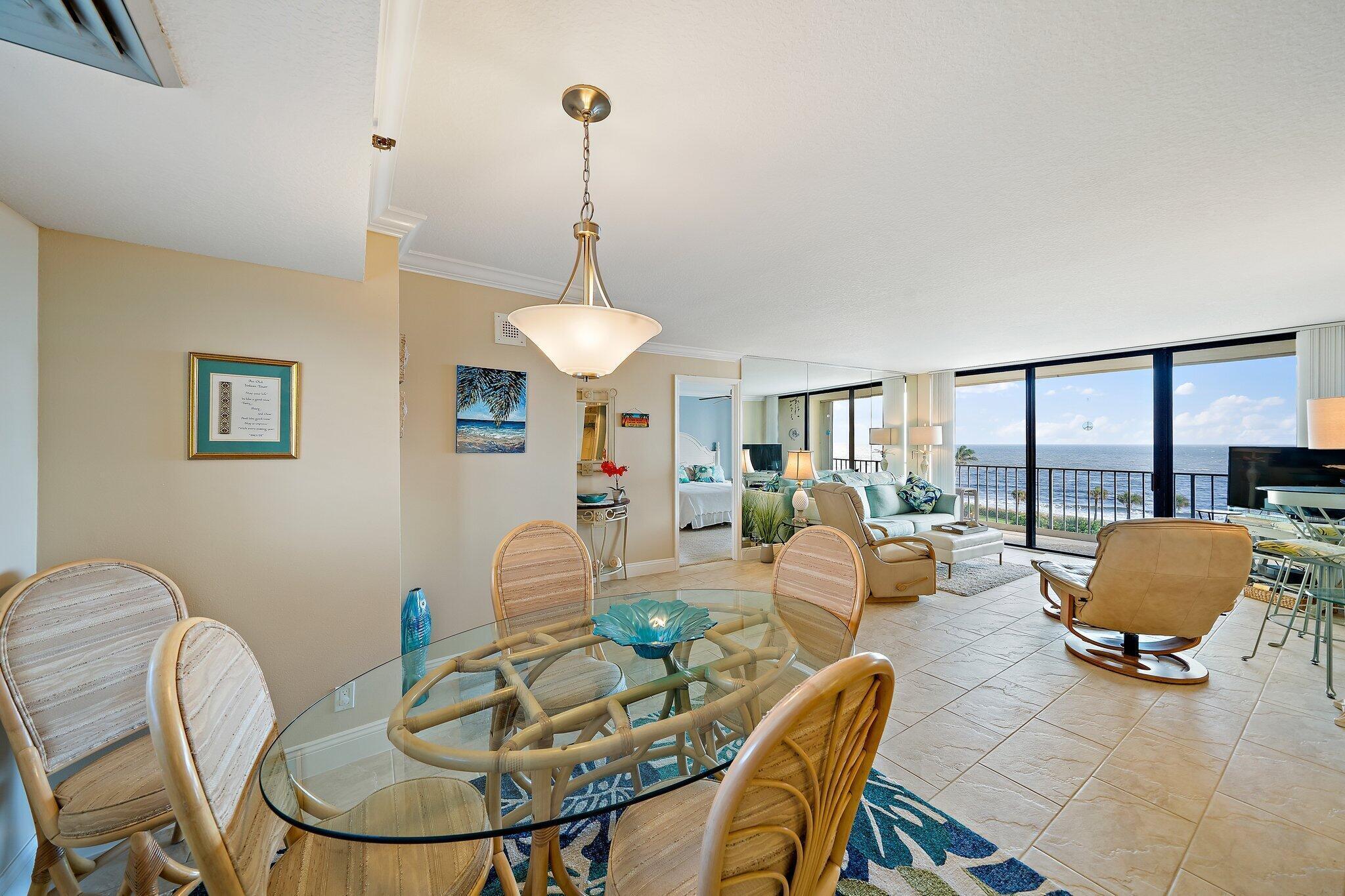 100 Ocean Trail Way, Unit 609 Jupiter, FL 33477 - Photo 16 of 66 a living room with furniture and a table
