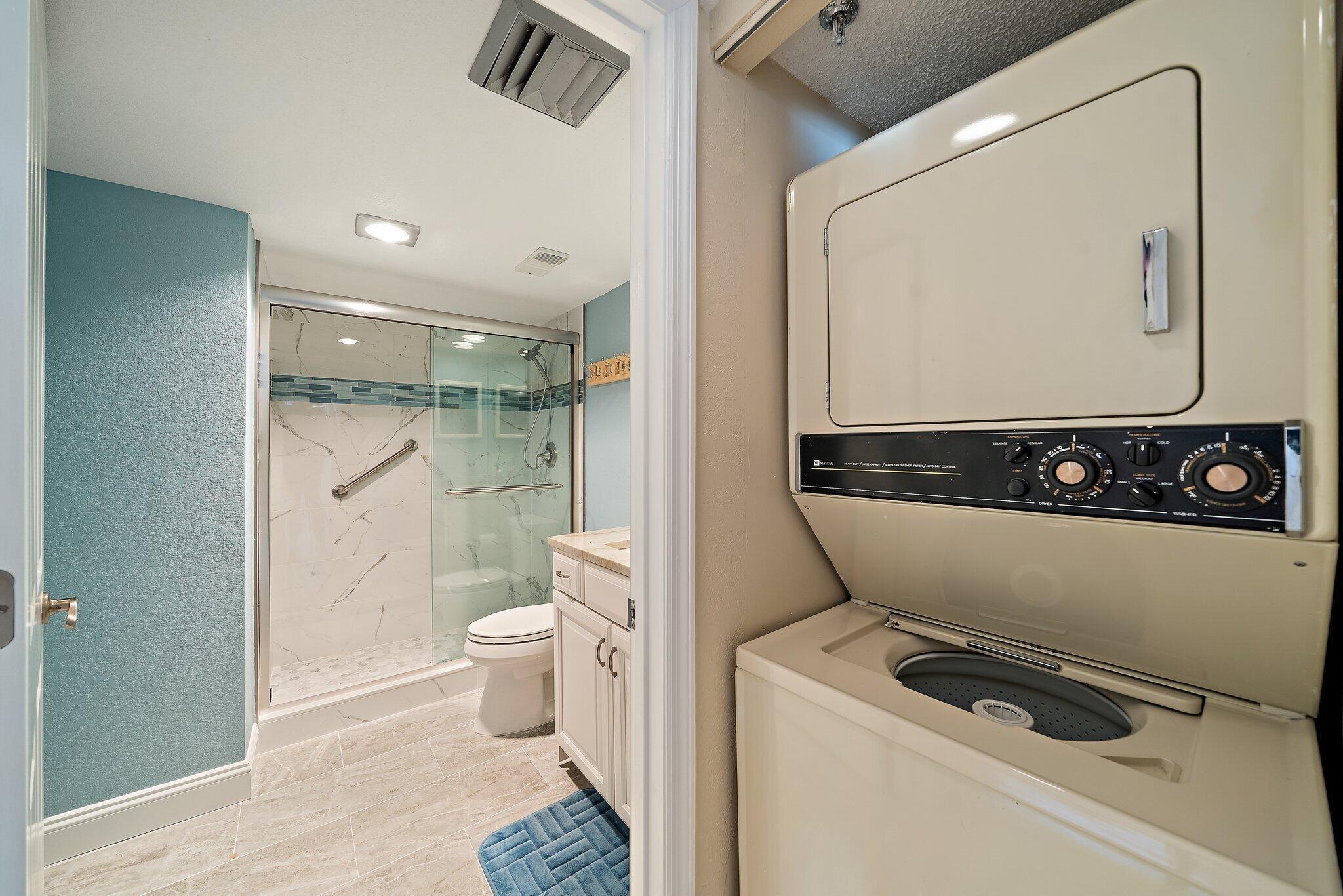 100 Ocean Trail Way, Unit 609 Jupiter, FL 33477 - Photo 28 of 66 a bathroom with a toilet a sink and glass door