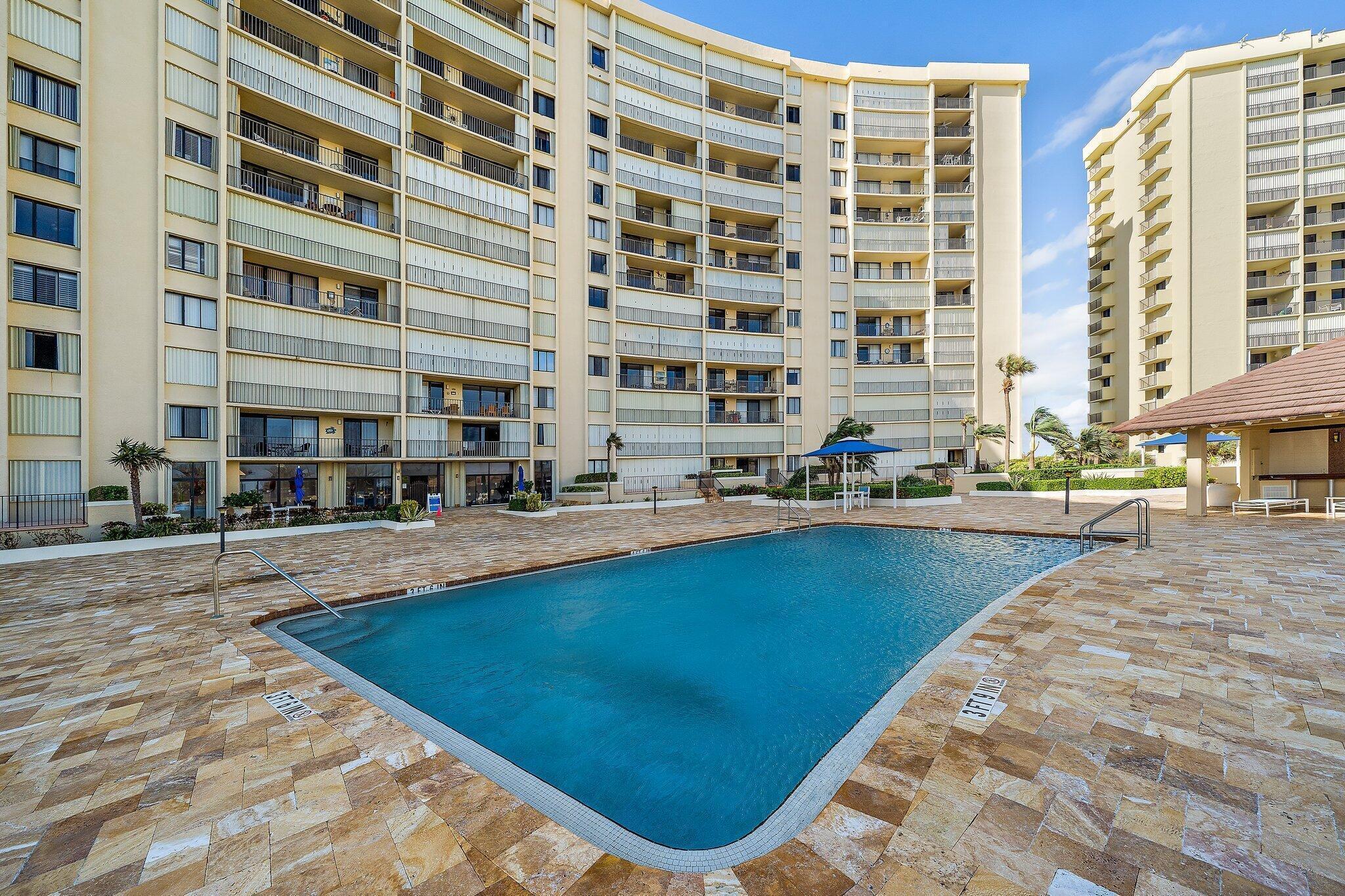 100 Ocean Trail Way, Unit 609 Jupiter, FL 33477 - Photo 39 of 66 a view of swimming pool with outdoor seating