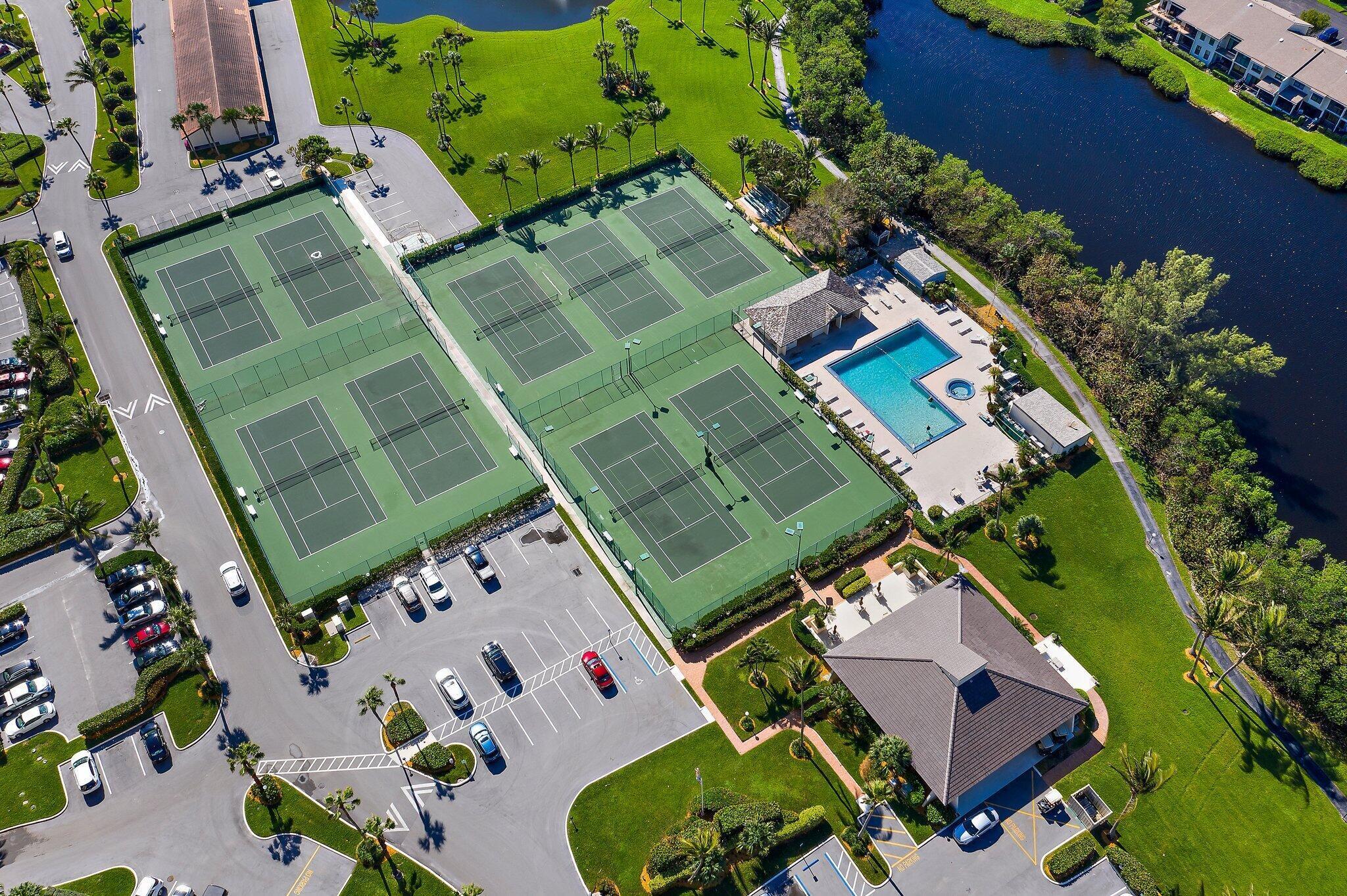100 Ocean Trail Way, Unit 609 Jupiter, FL 33477 - Photo 65 of 66 an aerial view of a house a yard and outdoor seating
