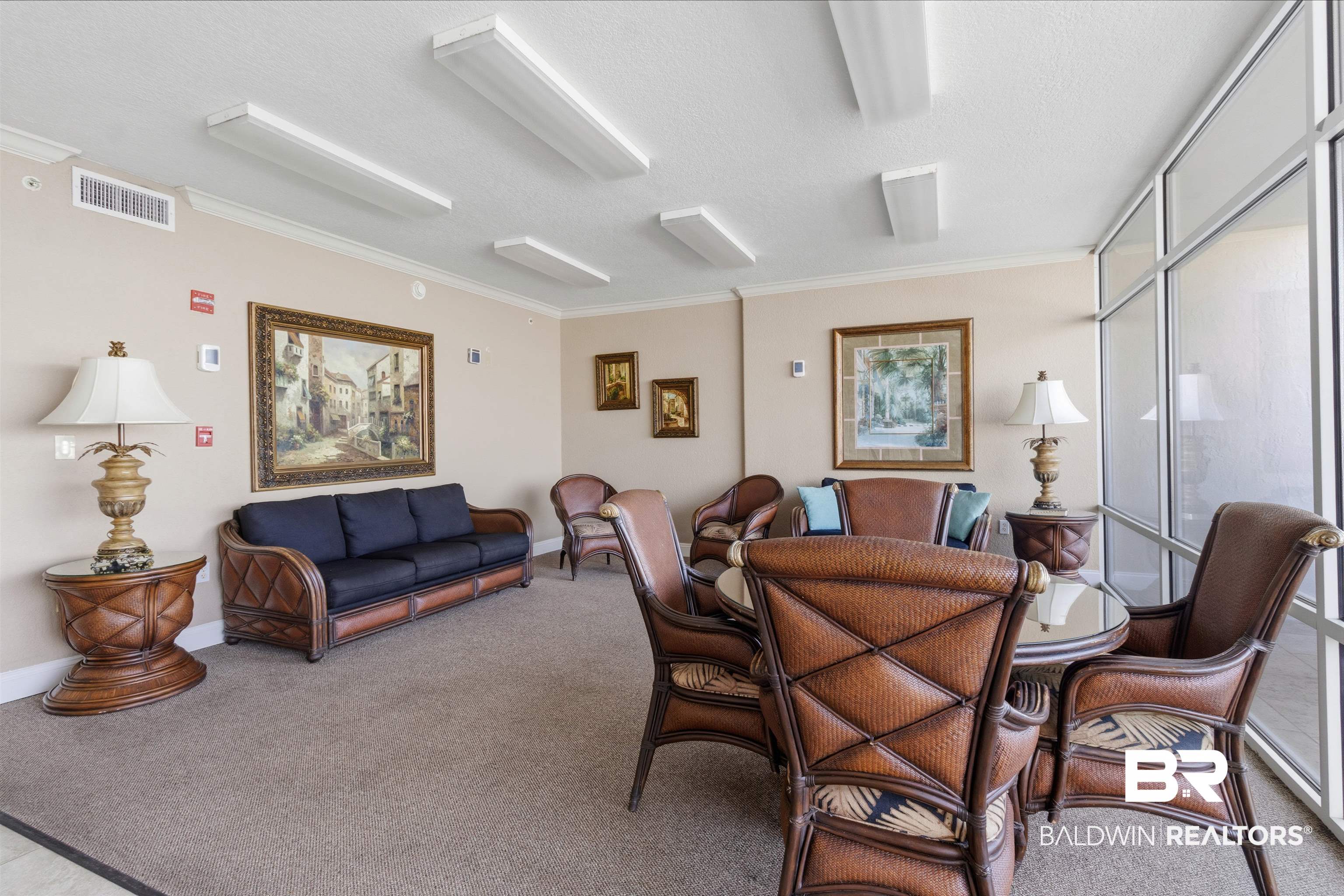 3564 Bayou Road, Unit 203 Orange Beach, AL 36561 - Photo 34 of 53 Lounge area featuring large-format windows, neutral wall tones, and recessed lighting