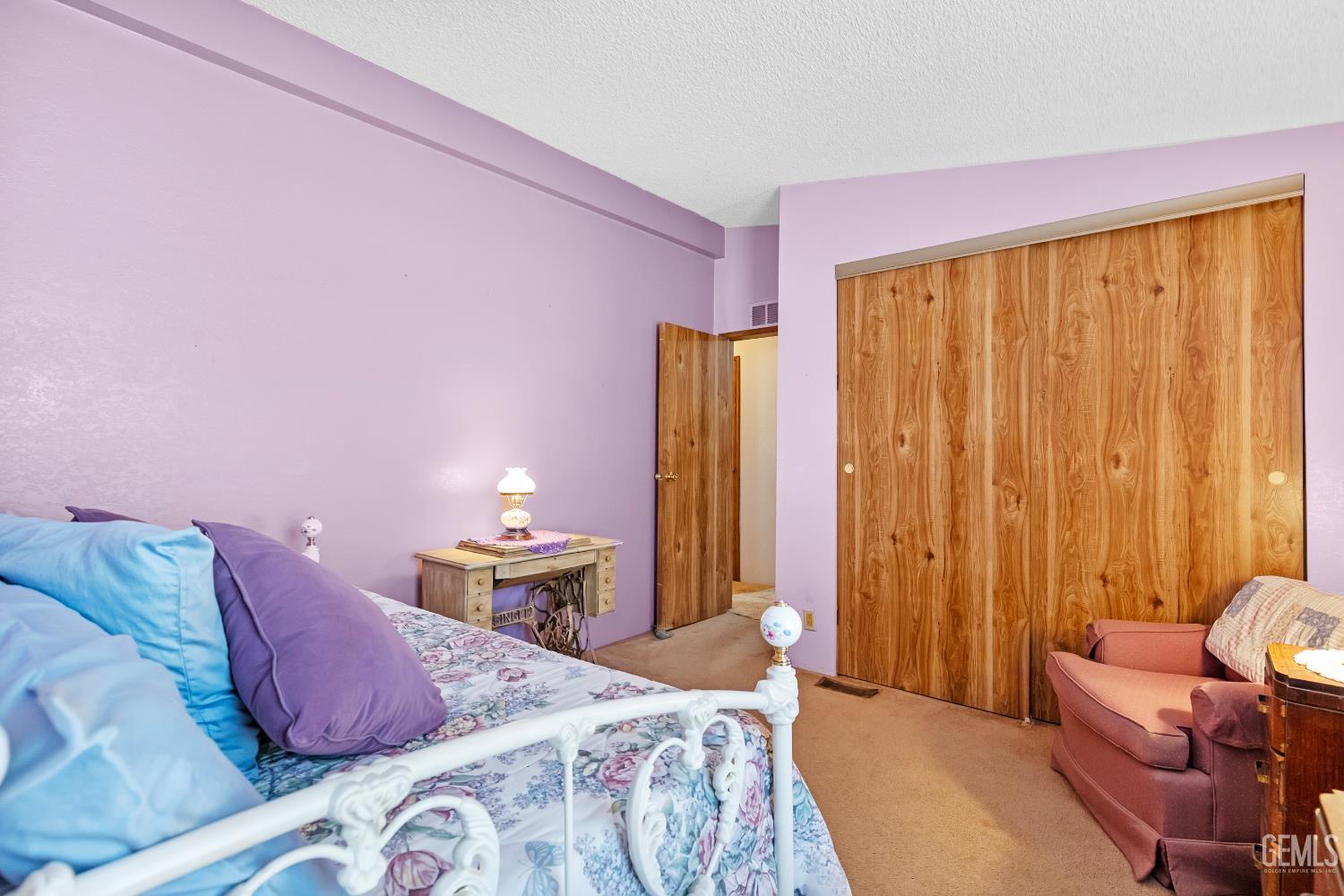 Undisclosed Address Tehachapi, CA 93561 - Photo 17 of 32 a bed room with a bed and a chair