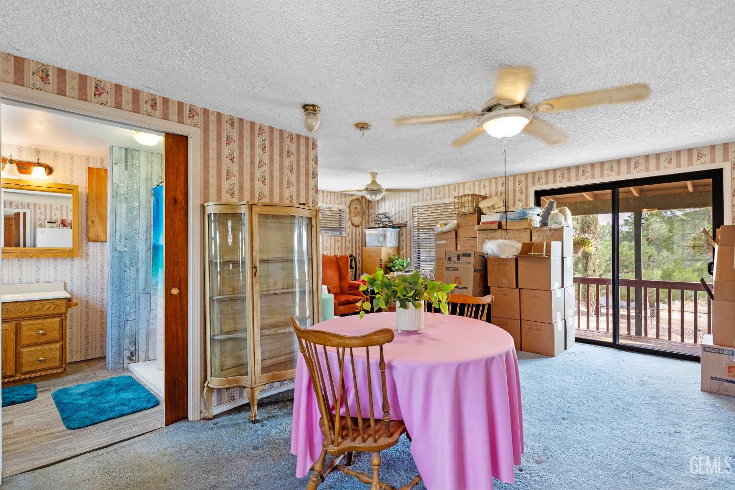 Undisclosed Address Tehachapi, CA 93561 - Photo 18 of 32 a dining room with furniture a chandelier and a large window