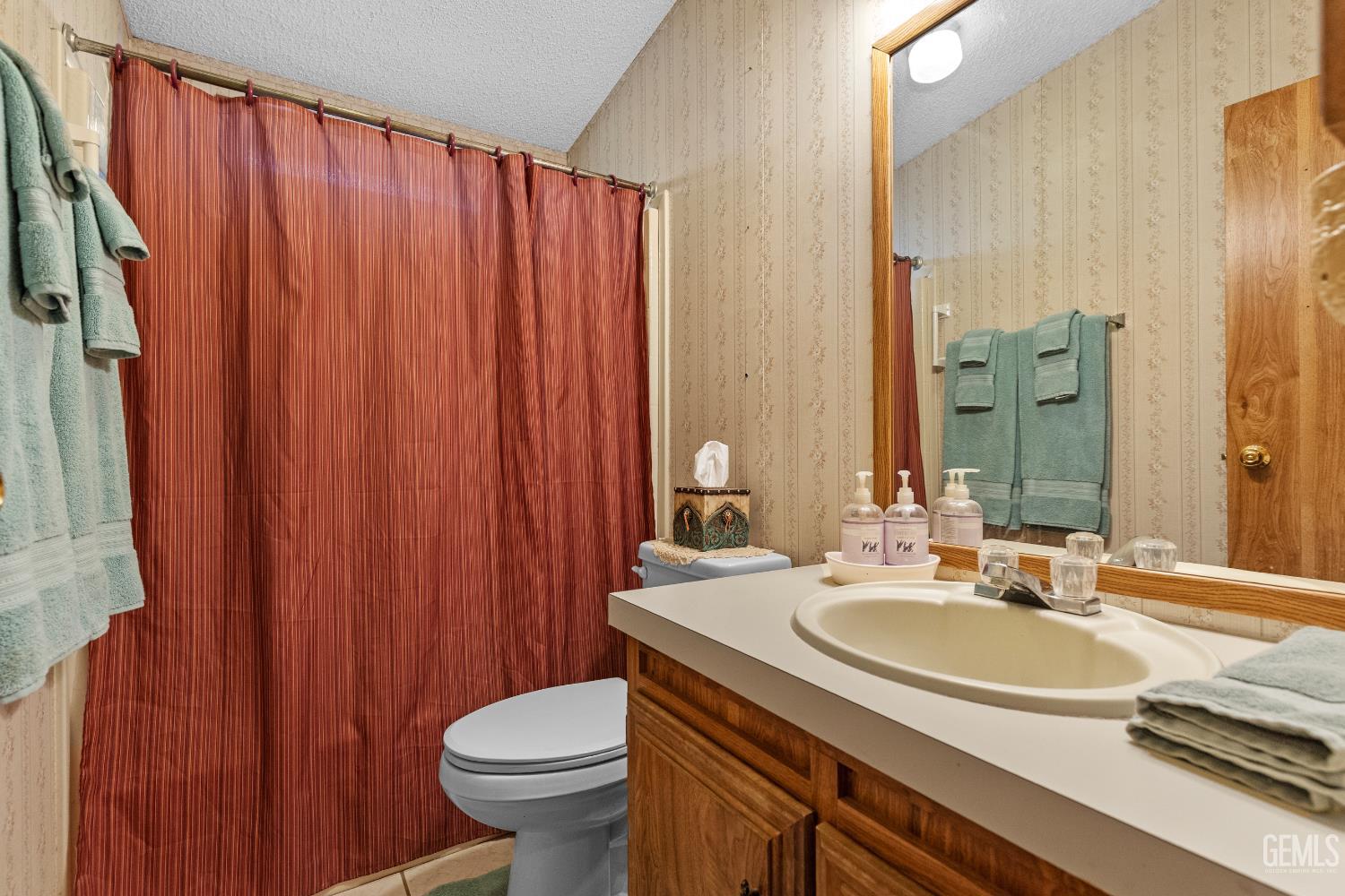Undisclosed Address Tehachapi, CA 93561 - Photo 20 of 32 a bathroom with a sink a toilet and shower