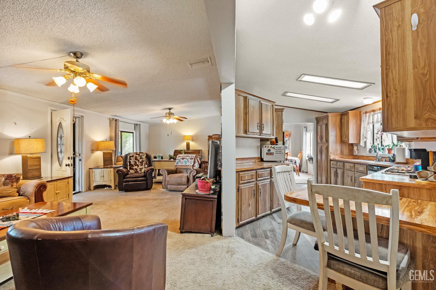 Undisclosed Address Tehachapi, CA 93561 - Photo 7 of 32 a living room with stainless steel appliances kitchen island granite countertop furniture and a kitchen view