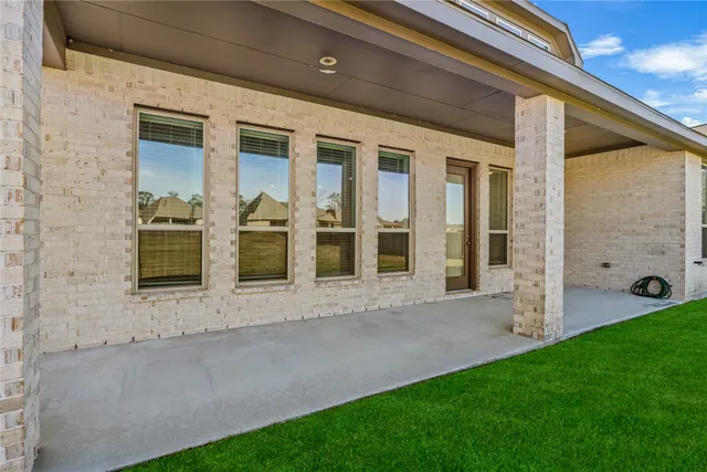 a view of front door of house with yard