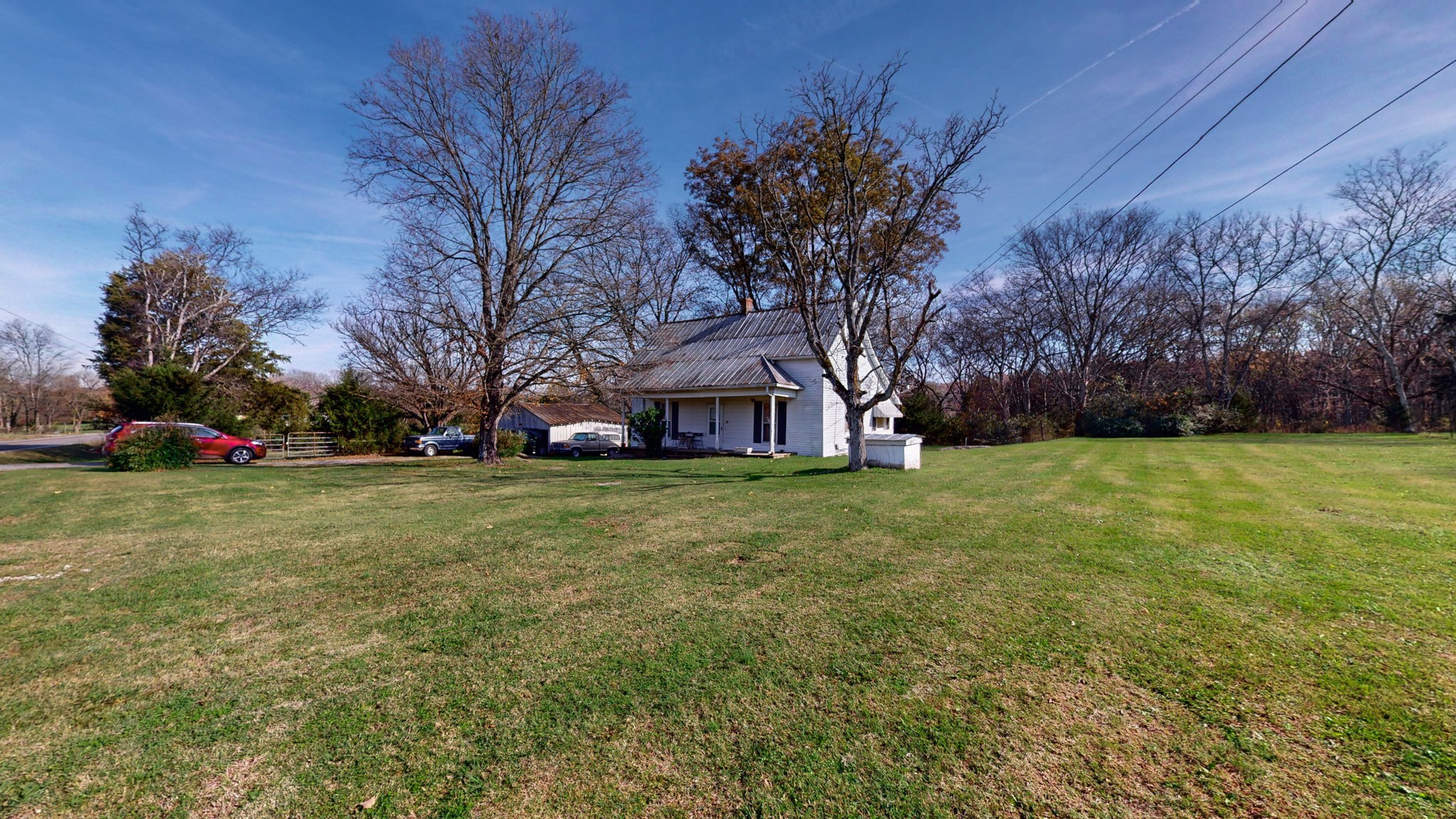 7477 Almaville Road Murfreesboro, TN 37128 - Photo 6 of 29 a view of a house with a big yard and large trees