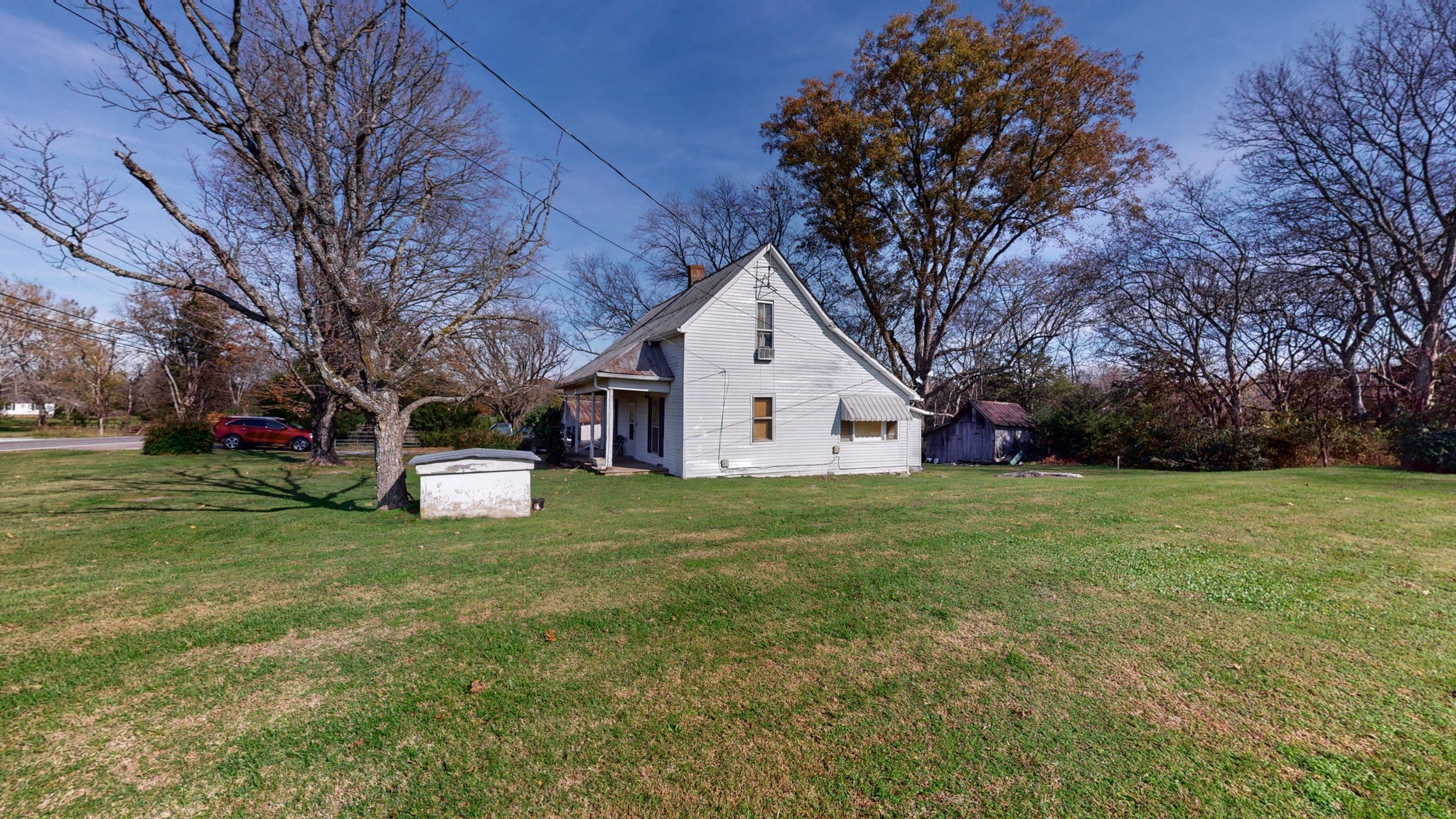 7477 Almaville Road Murfreesboro, TN 37128 - Photo 7 of 29 a view of a white house that has a tree in a yard