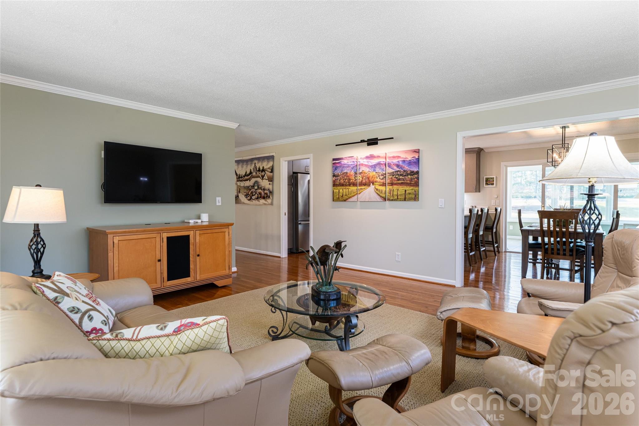 774 Crooked Creek Road Hendersonville, NC 28739 - Photo 11 of 46 a living room with furniture and a flat screen tv
