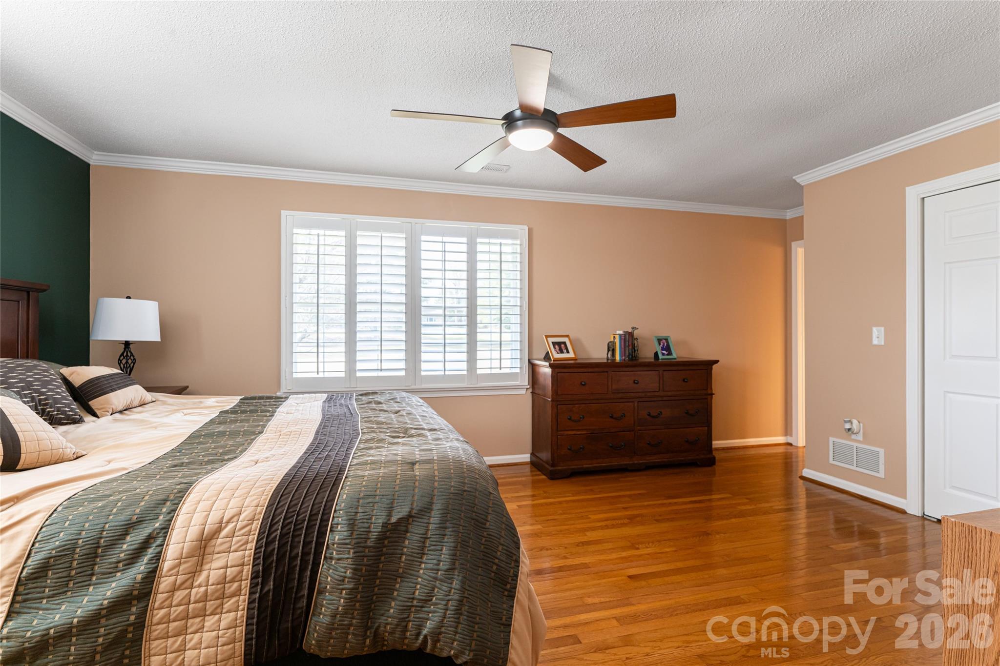 774 Crooked Creek Road Hendersonville, NC 28739 - Photo 19 of 46 a bedroom with a bed and a dresser