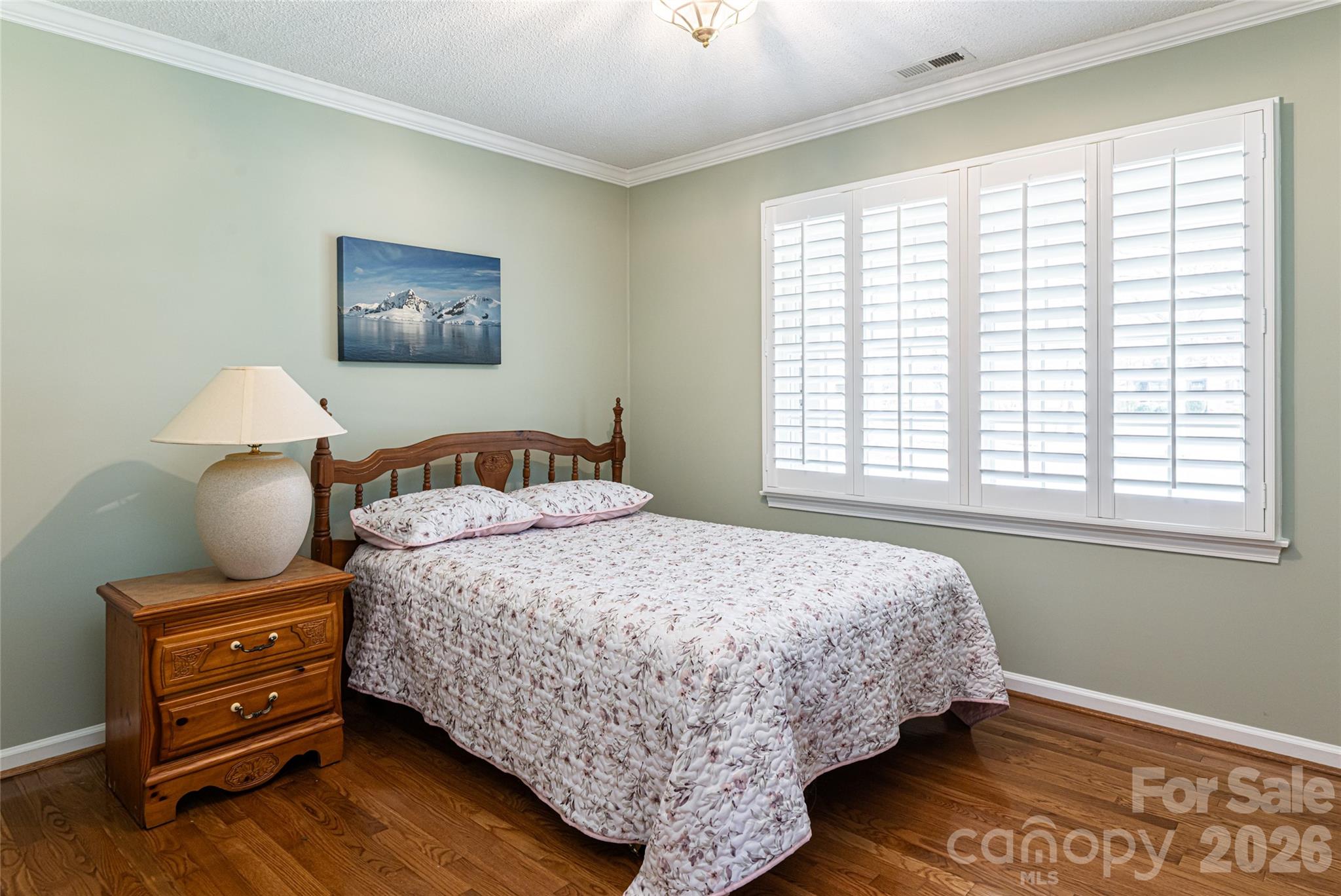 774 Crooked Creek Road Hendersonville, NC 28739 - Photo 23 of 46 a bedroom with bed and a window