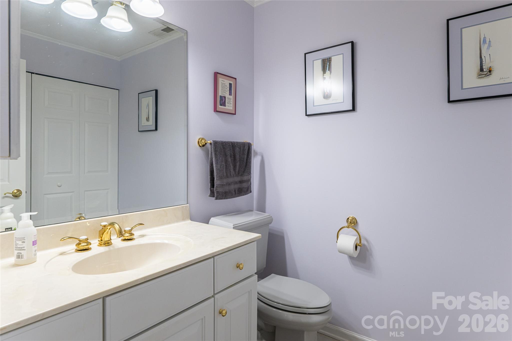774 Crooked Creek Road Hendersonville, NC 28739 - Photo 24 of 46 a bathroom with a granite countertop sink mirror and toilet