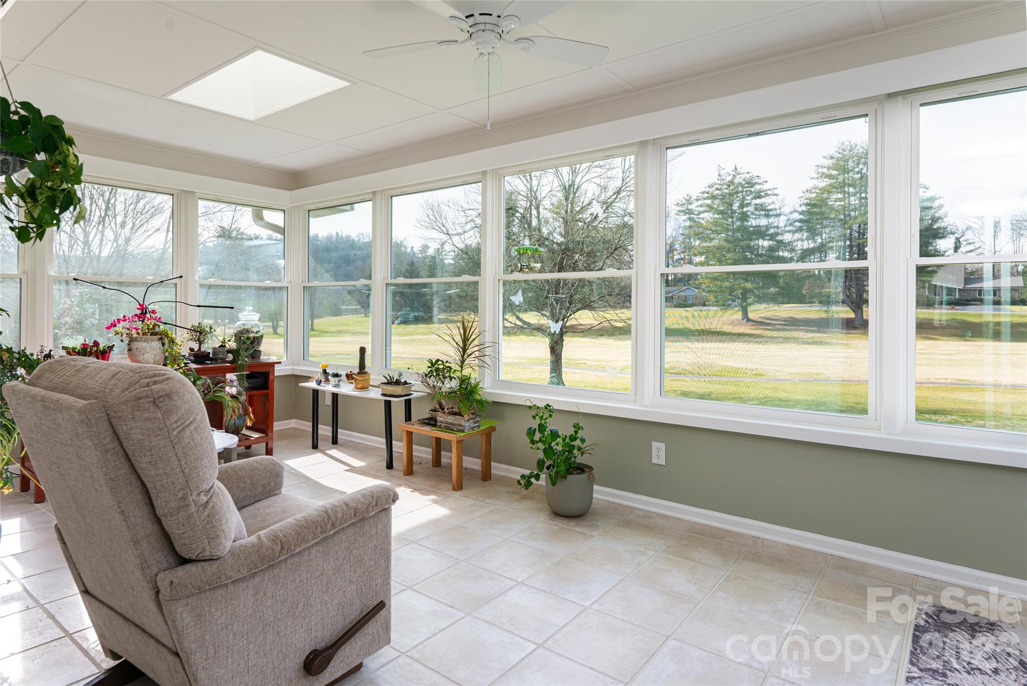 774 Crooked Creek Road Hendersonville, NC 28739 - Photo 26 of 46 a living room with furniture and a large window