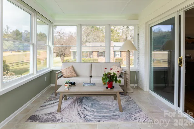 a living room filled with furniture and a table