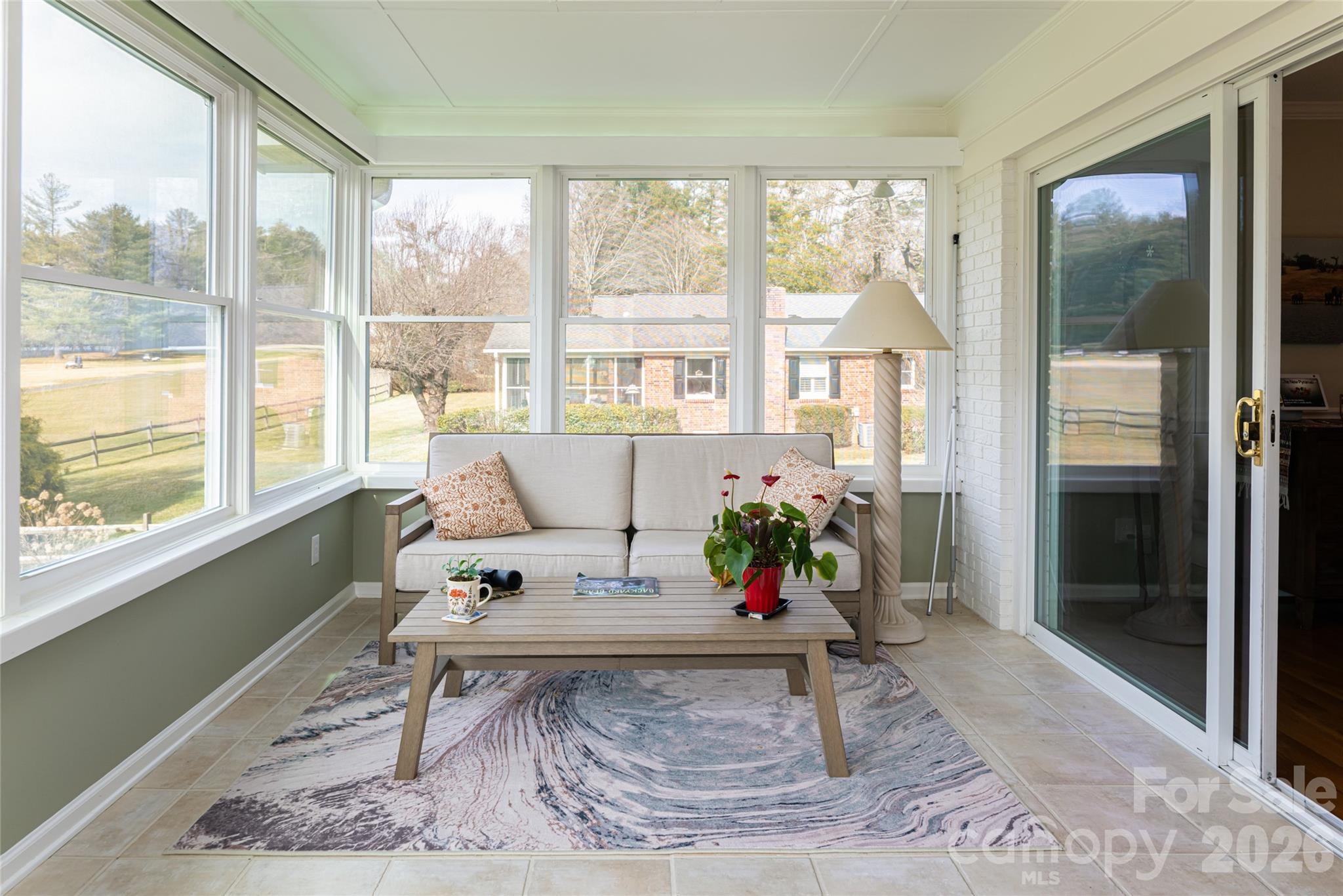 774 Crooked Creek Road Hendersonville, NC 28739 - Photo 28 of 46 a living room filled with furniture and a table