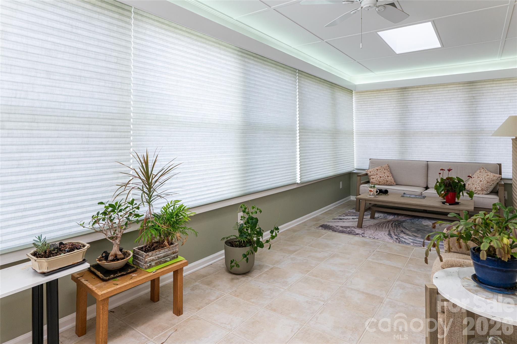774 Crooked Creek Road Hendersonville, NC 28739 - Photo 29 of 46 a room with furniture and a potted plant