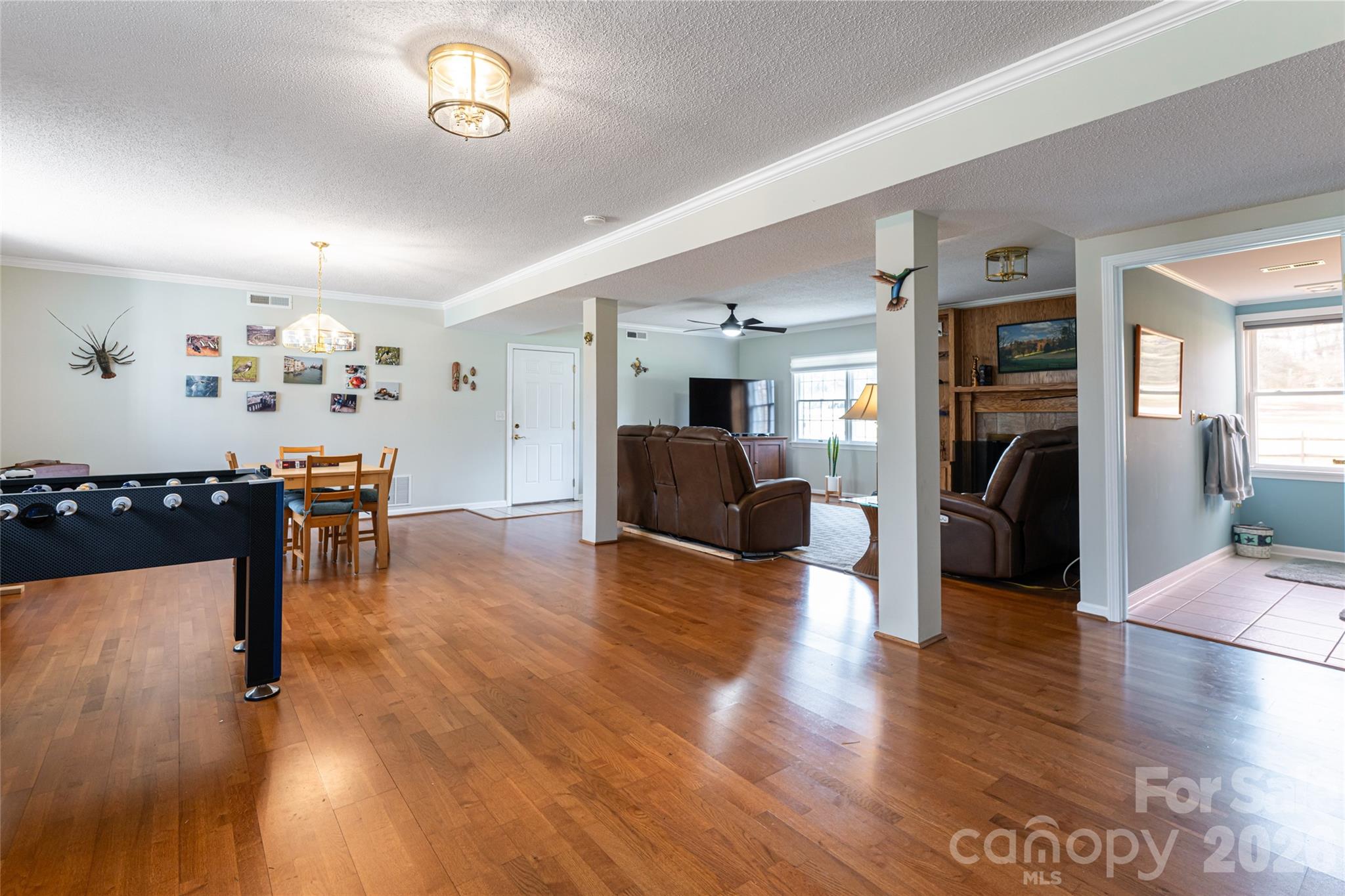 774 Crooked Creek Road Hendersonville, NC 28739 - Photo 33 of 46 a living room with furniture and a wooden floor