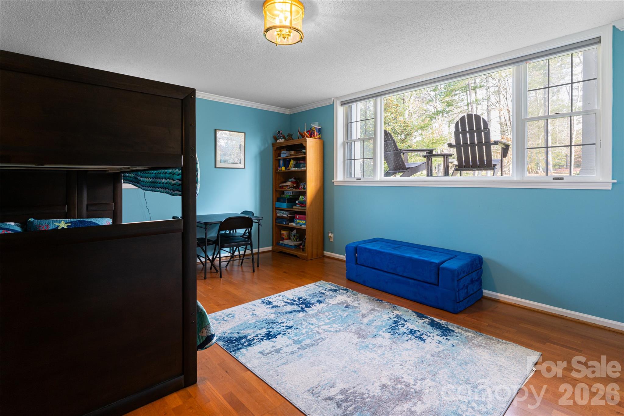774 Crooked Creek Road Hendersonville, NC 28739 - Photo 37 of 46 a room with furniture and a flat screen tv