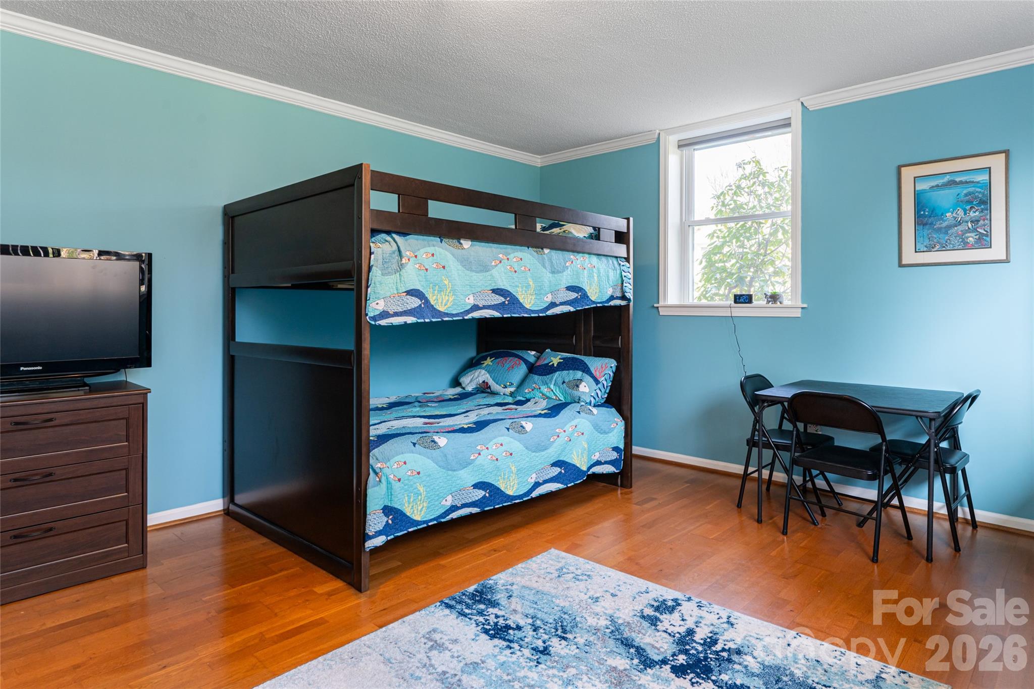 774 Crooked Creek Road Hendersonville, NC 28739 - Photo 38 of 46 a bedroom with furniture and a bed