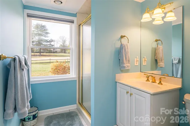 a bathroom with a sink tub and a mirror
