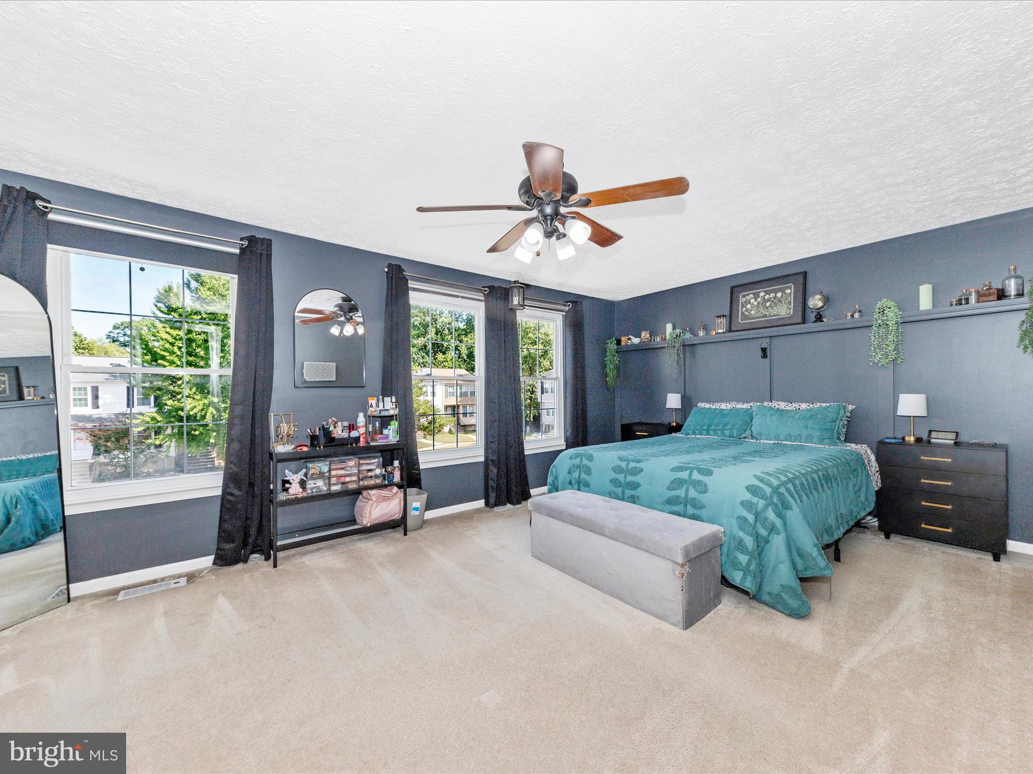 7283 Procopio Circle Columbia, MD 21046 - Photo 17 of 39 a spacious bedroom with a bed and a chandelier