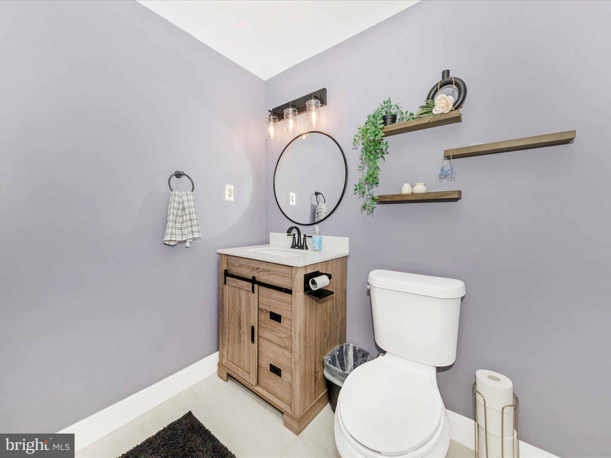 7283 Procopio Circle Columbia, MD 21046 - Photo 30 of 39 a bathroom with a toilet a sink and a mirror