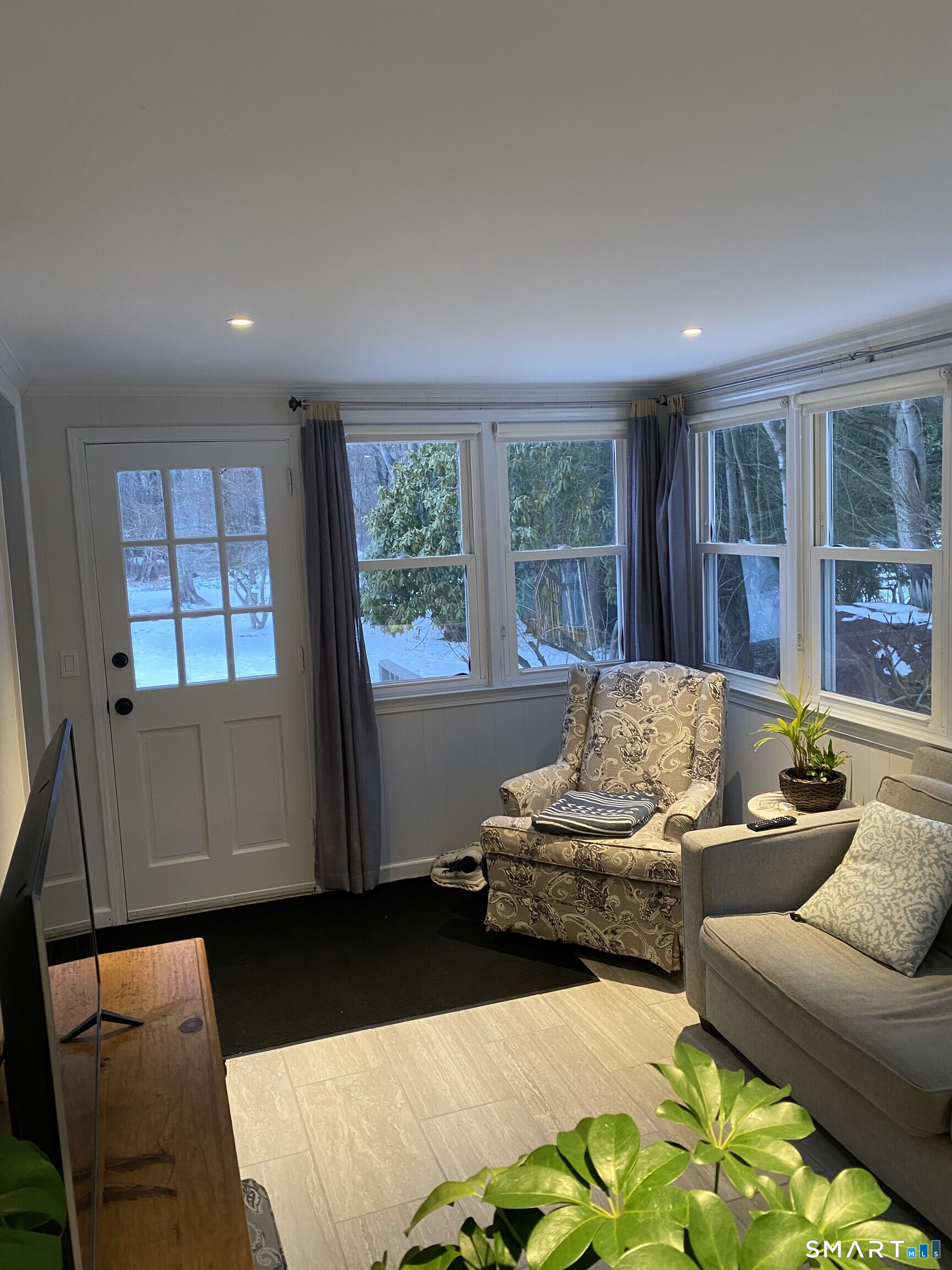 276 Dunnlea Road Fairfield, CT 06824 - Photo 14 of 26 a living room with furniture and large window