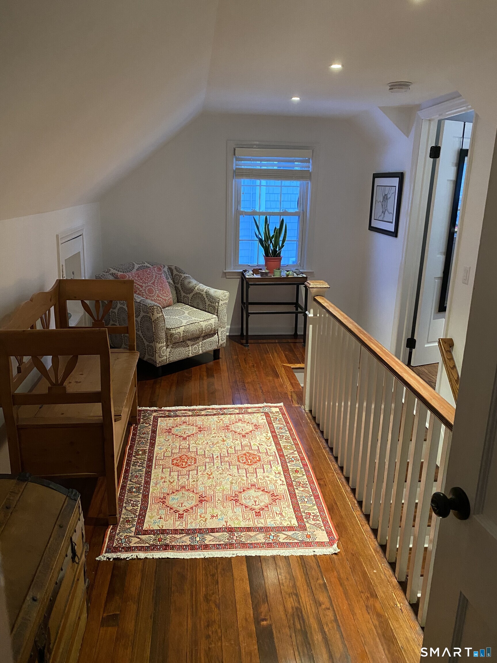 276 Dunnlea Road Fairfield, CT 06824 - Photo 15 of 26 a living room with furniture and a rug