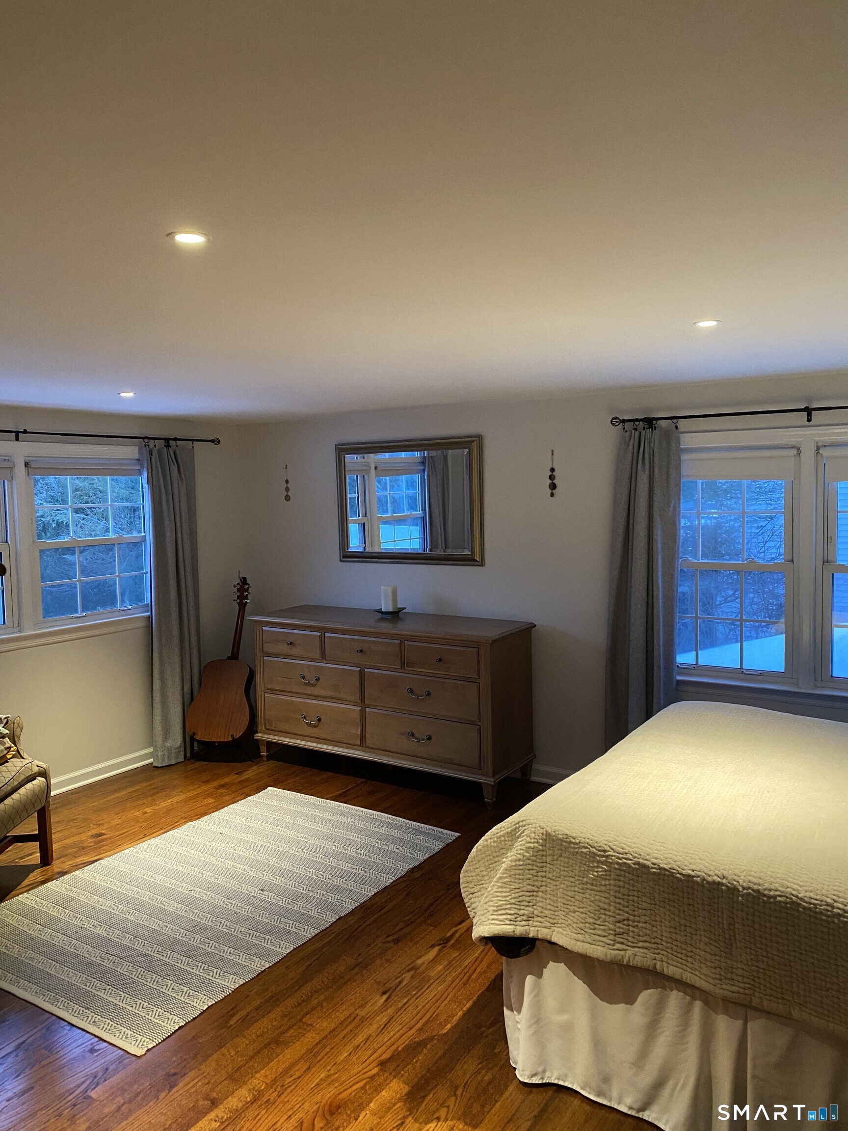 276 Dunnlea Road Fairfield, CT 06824 - Photo 16 of 26 a bedroom with a bed and a window