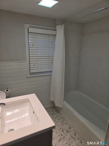 a bathroom with a sink and a bathtub